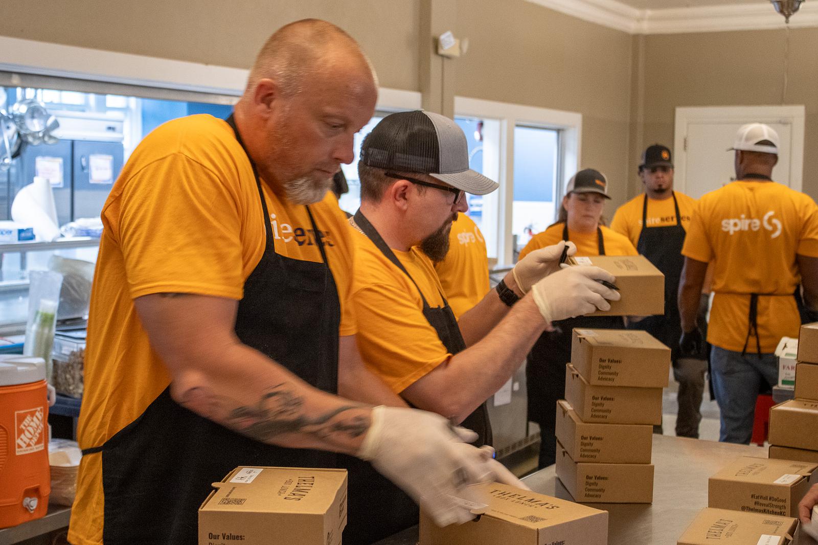 spire volunteers boxing items 